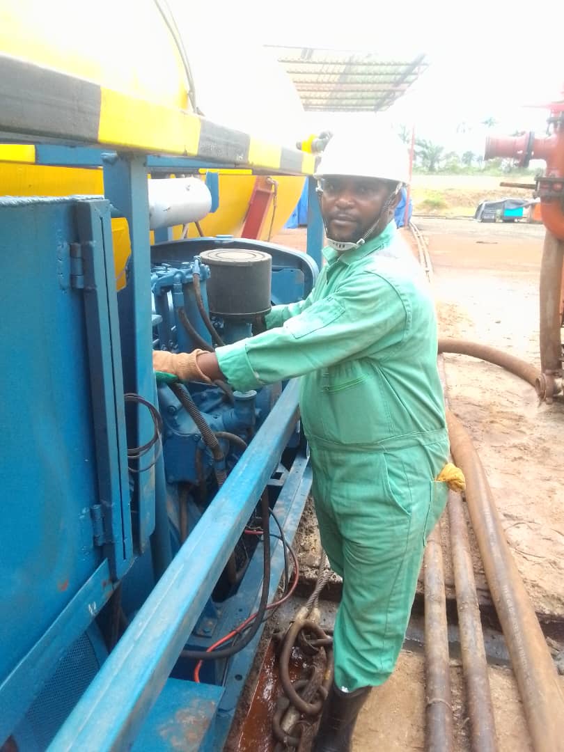 Ashdrey field specialist working with pumping equipment